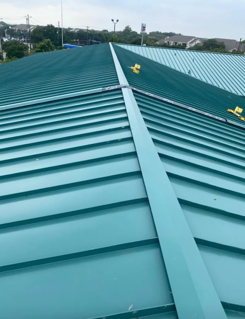 Green commercial metal roof ridge and valley for Metal Roof Repair in Broadlands